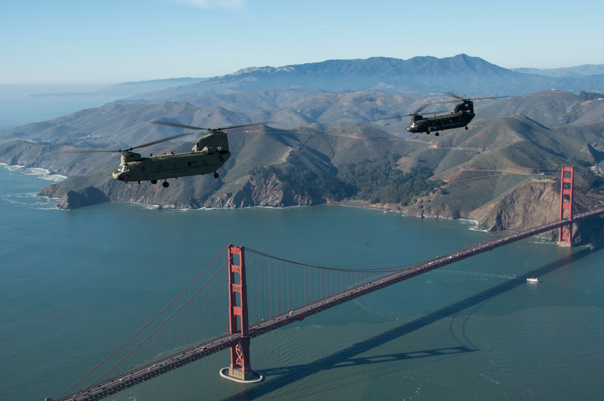 Military helicopters over suspension bridge, full size