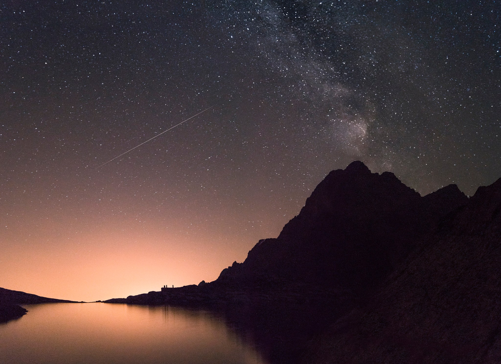 Milky Way and meteor over mountain lake, full size