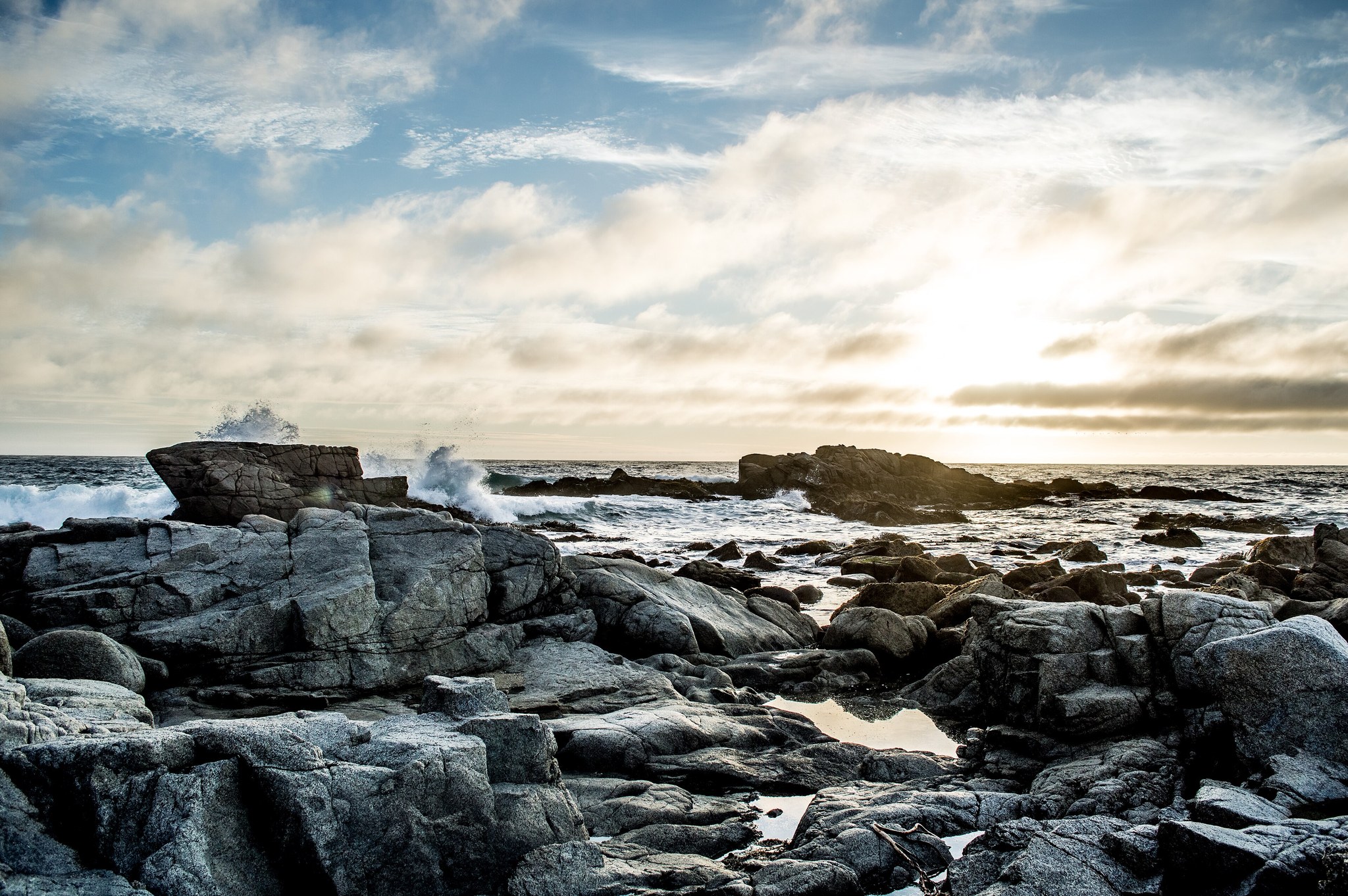 Waves crashing on rocky shore, full size