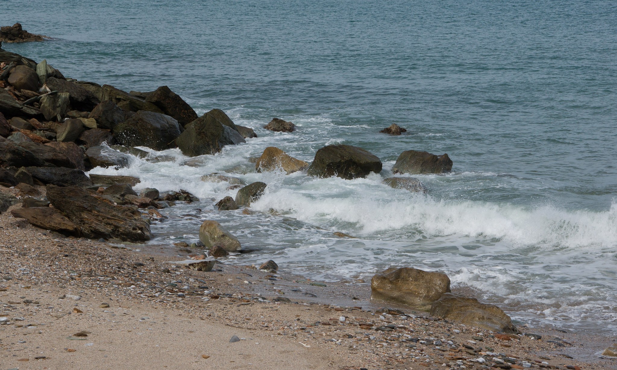 Waves breaking on rocky shore, full size