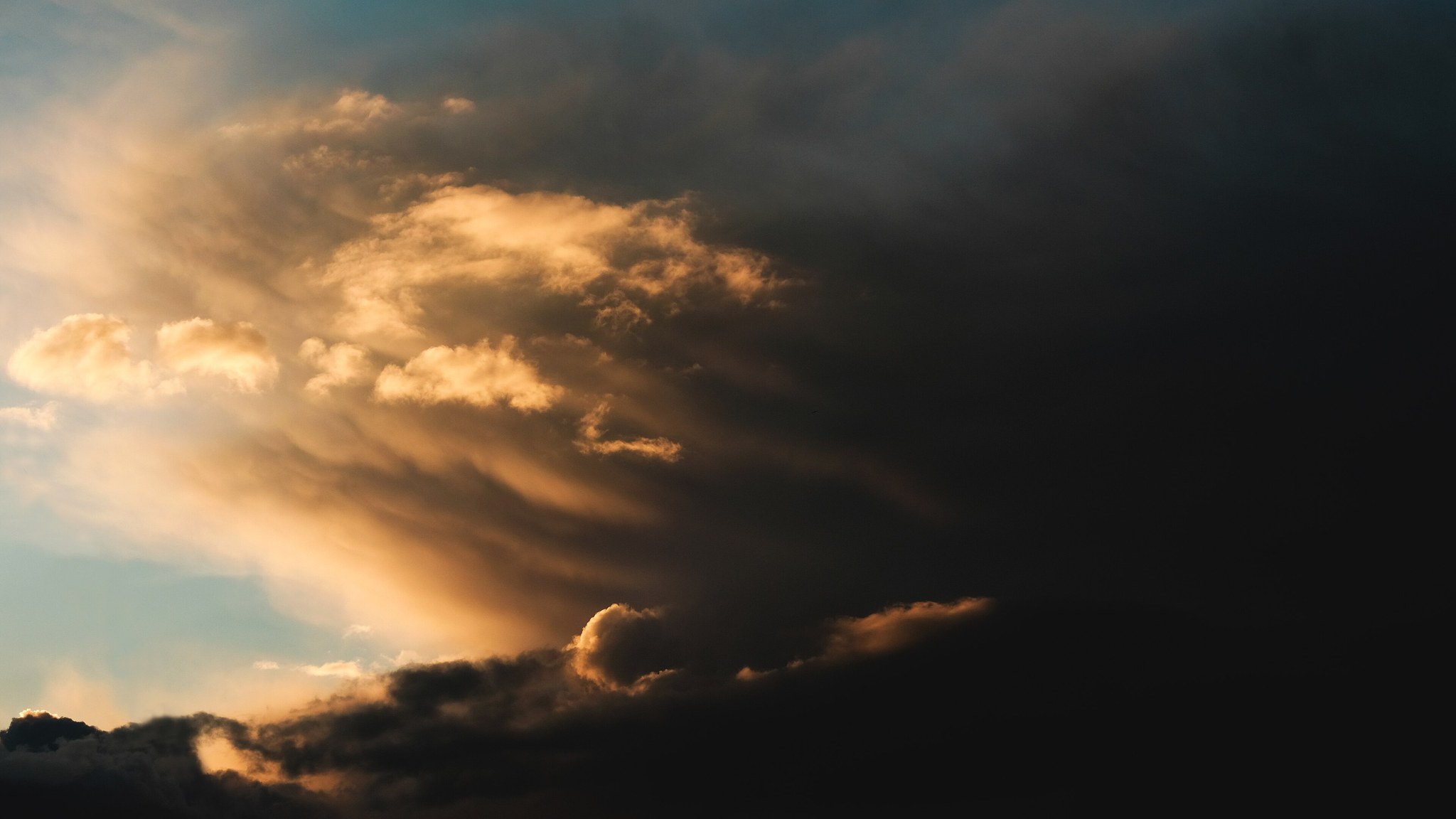 Dark storm clouds at sunset, full size